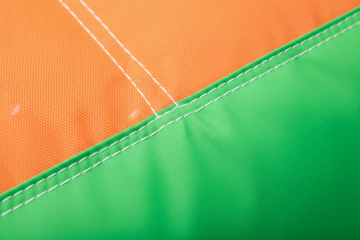 Close-up of durable Oxford fabric stitching on inflatable bounce house
